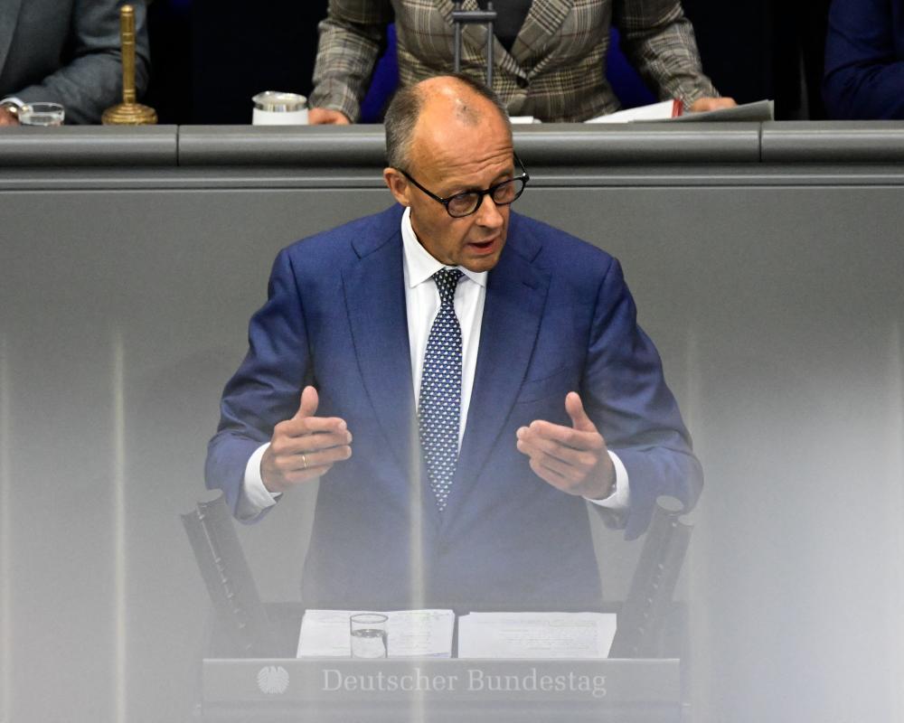German Chancellor Accuses AfD of Ethnic Cleansing in Remigration Row