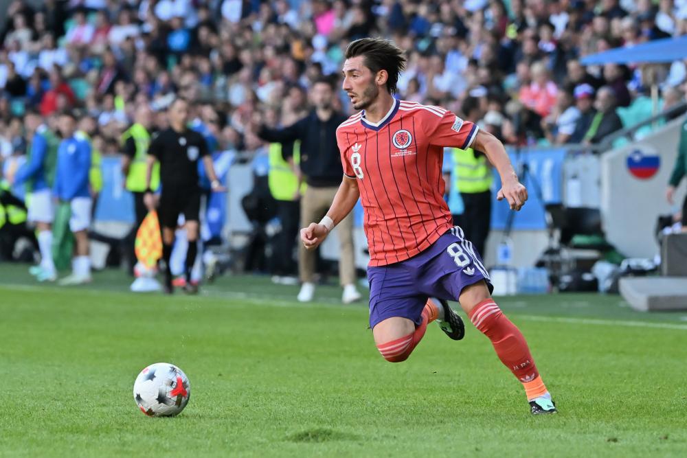 Scotland's Success: Pocognoli Wants Smiling Gilmour to Shine