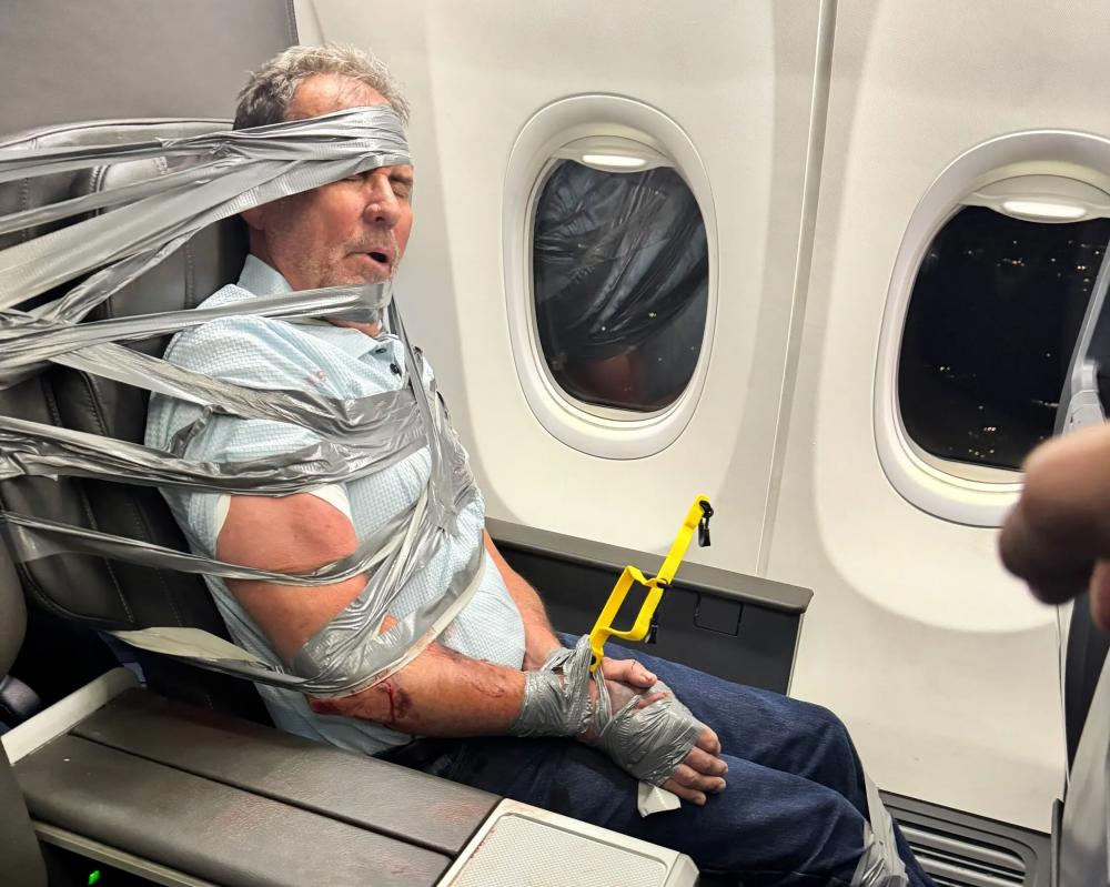 American Airlines Passenger Duct-Taped to Seat Claims Memory Loss