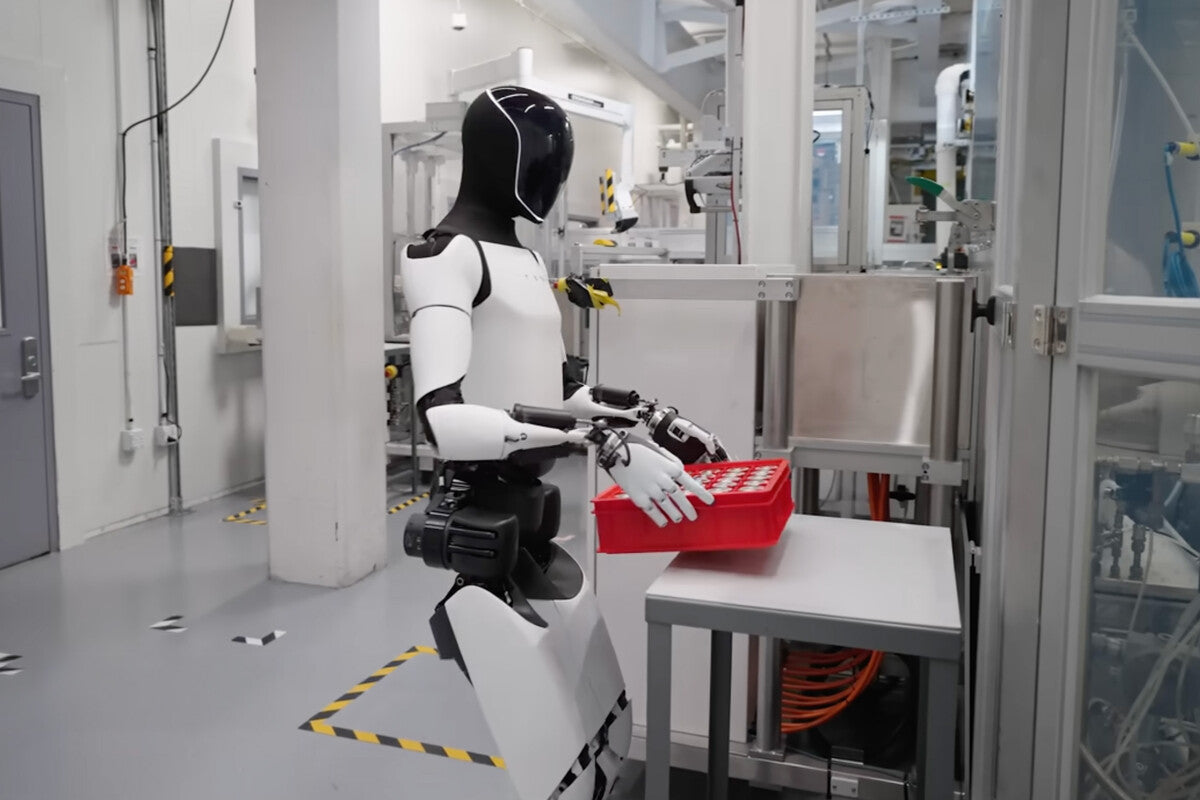 Tesla Optimus: Workers Train Robots That May Replace Them