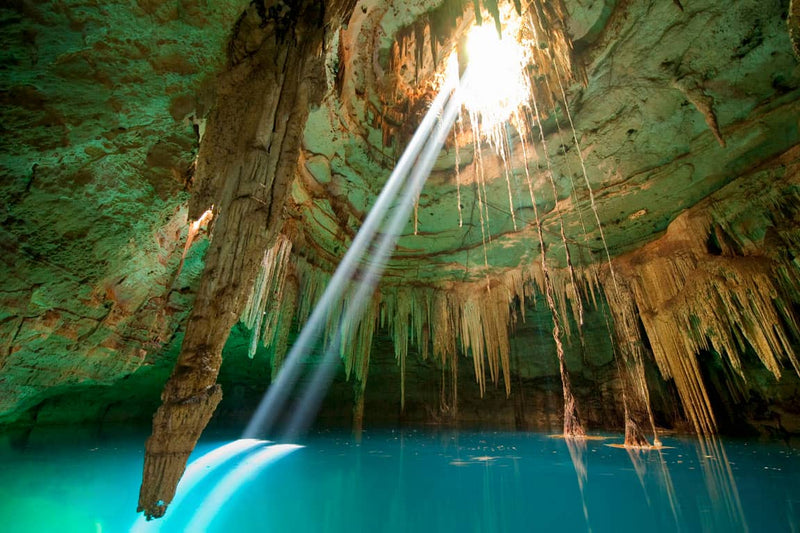 Crystal clear blue water in a cenote near Cancun