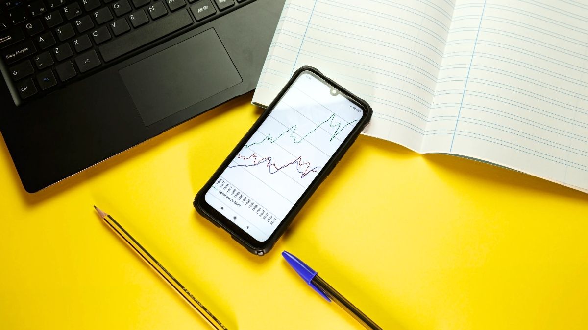 How Much Is $1000 a Month Invested for 30 Years - Smartphone, notebook and laptop on yellow background - Grand Goldman