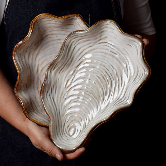 Plaque en forme de coquille