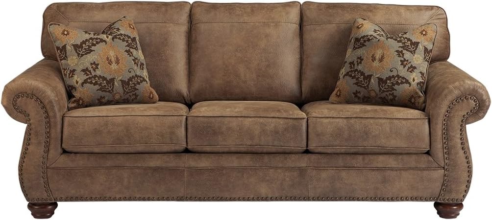 Signature Design by Ashley Larkinhurst Faux Leather Sofa with Nailhead Trim and 2 Accent Pillows, Brown