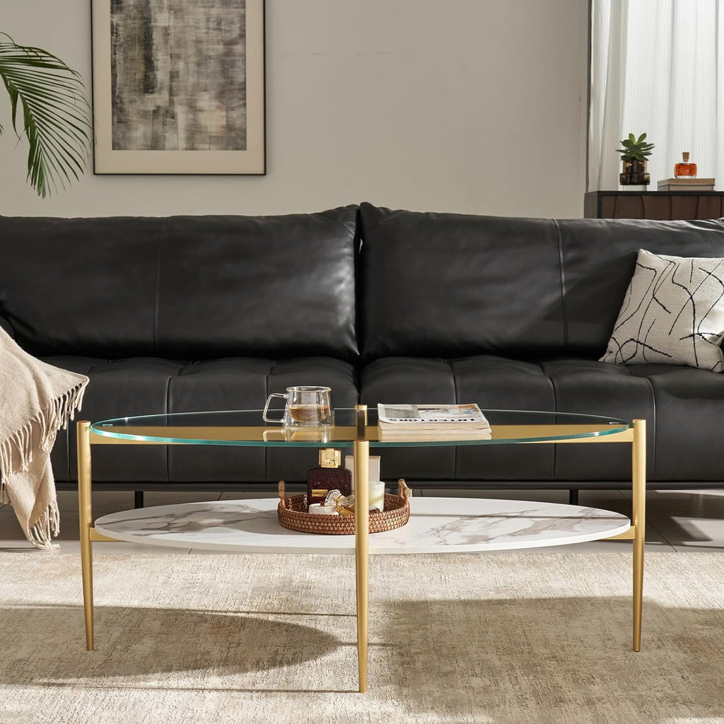 Shrine Oval Coffee Table, Mid-Century Modern Design, 2-Tier Structure, Clear Glass Top and White MDF Shelf, 47" D x 21" W x 17" H, Sleek Conical Metal Legs with Gold Finish