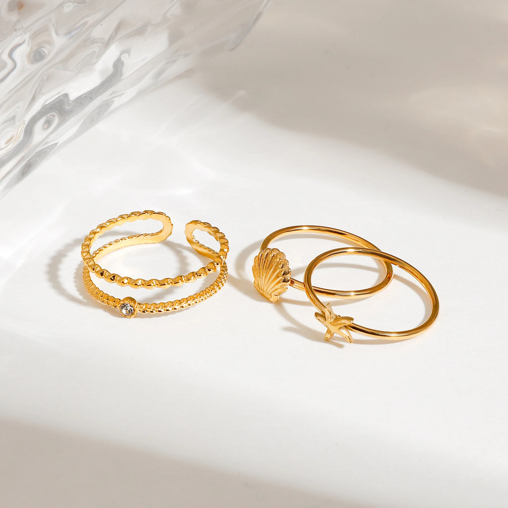 Juego de 3 anillos apilables elegantes para mujer de acero inoxidable chapados en oro de 18K con concha acanalada inspirada en el océano, estrella de mar y redondo