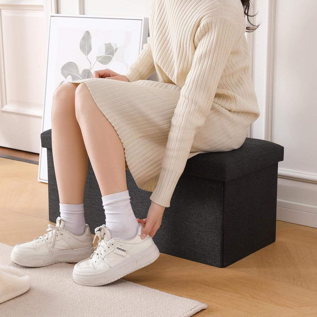 CUYOCA Storage Ottoman Bench Foldable Seat Footrest Shoe Bench End of Bed Storage with Flipping Lid, 75L Storage Space, 30 inches Linen Fabric Black - Grand Goldman