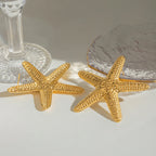 18K vergoldete Edelstahl-Hammerkorn-Stern-Meer-Ohrringe Damen Charms Metallstruktur Wasserdichter Schmuck Gala Geschenk