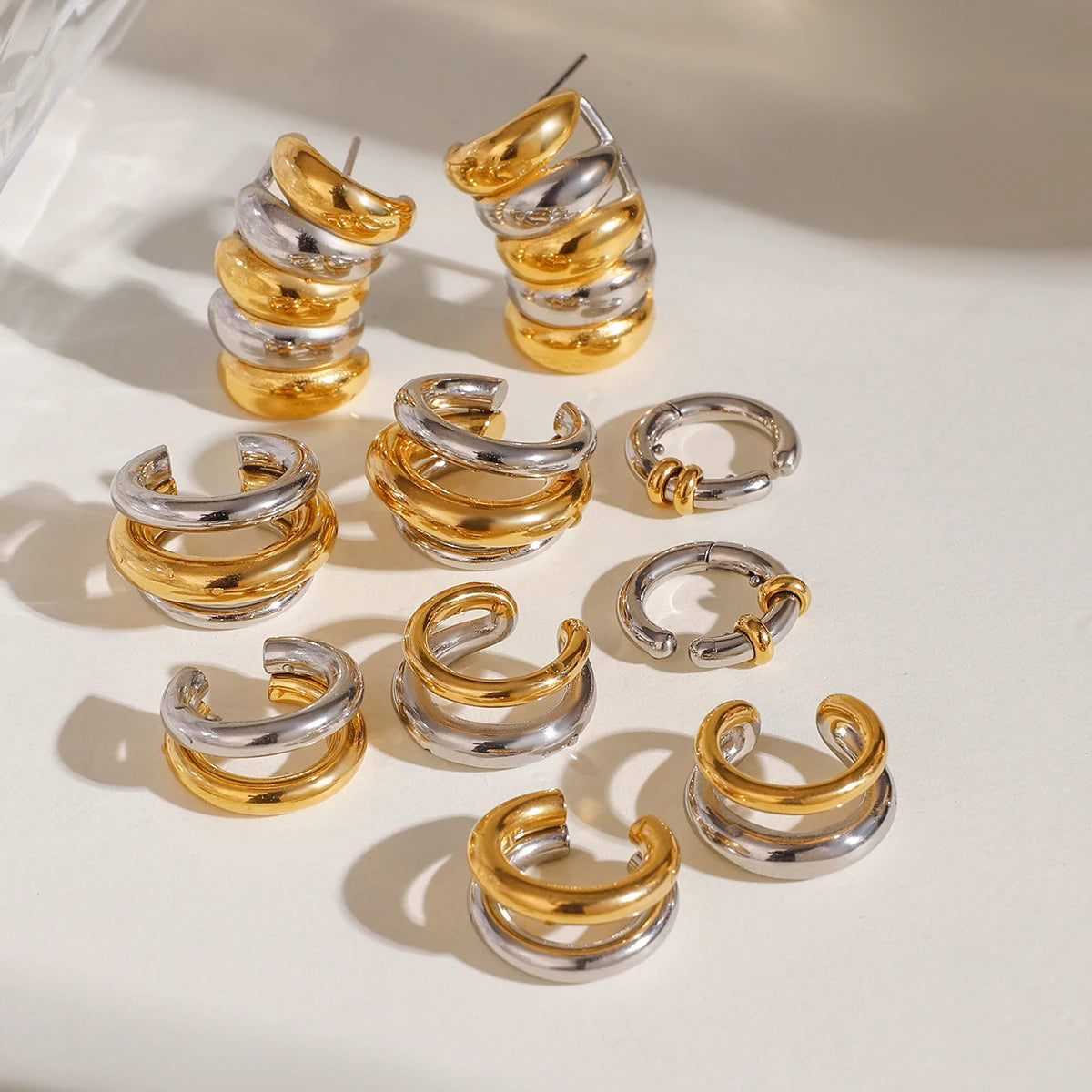 Creative 18K forgyldt rustfrit stål Geometrisk farvematchende øreclips-serie Dame vandtætte attraktive smykker