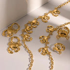 Collana/Anello/Orecchino/Braccialetto Combinazione Design Granchio Geometrico in Acciaio Inossidabile Placcato Oro 18K Gioielli Leggeri di Lusso per Donna