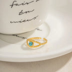 Bague Femme Personnalité Résistante à l'Eau Incrustation Turquoise Travail Ajouré Plaqué Or 18K Acier Inoxydable Design Œil du Diable Cadeau Délicat