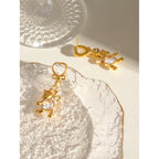 18K vergoldeter Edelstahl Weißer Katzenauge-Stein Runde Zirkon Panda Ohrringe Damen Metall Wasserdicht Modischer Charme Schmuck