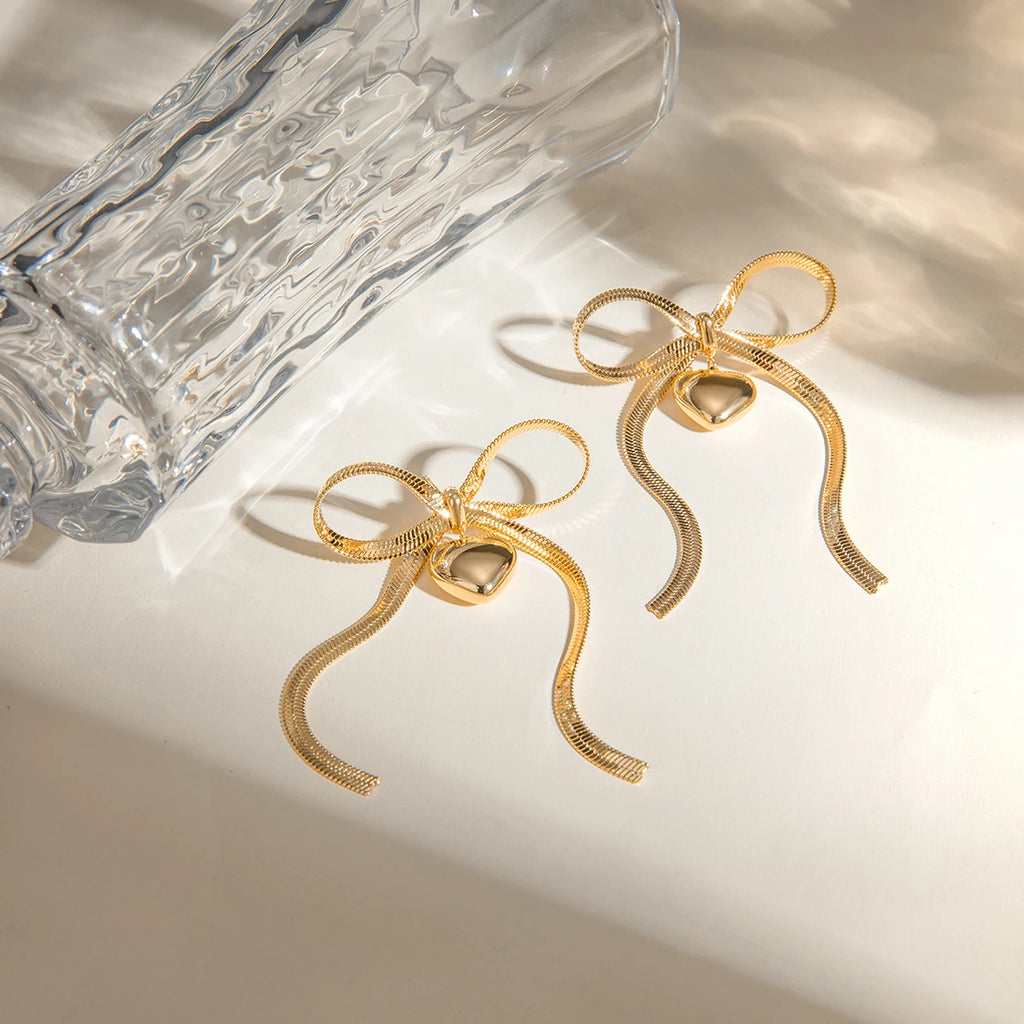 Catena a serpente in acciaio inossidabile placcato oro 18K orecchino pendente piatto a forma di cuore con fiocco amore gioielli romantici resistenti all'ossidazione regalo per gala