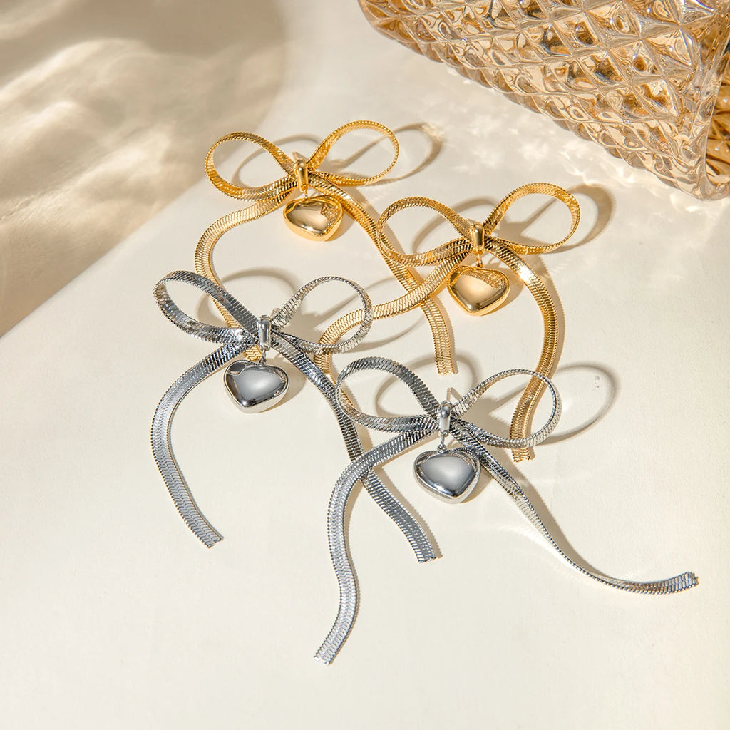 Catena a serpente in acciaio inossidabile placcato oro 18K orecchino pendente piatto a forma di cuore con fiocco amore gioielli romantici resistenti all'ossidazione regalo per gala