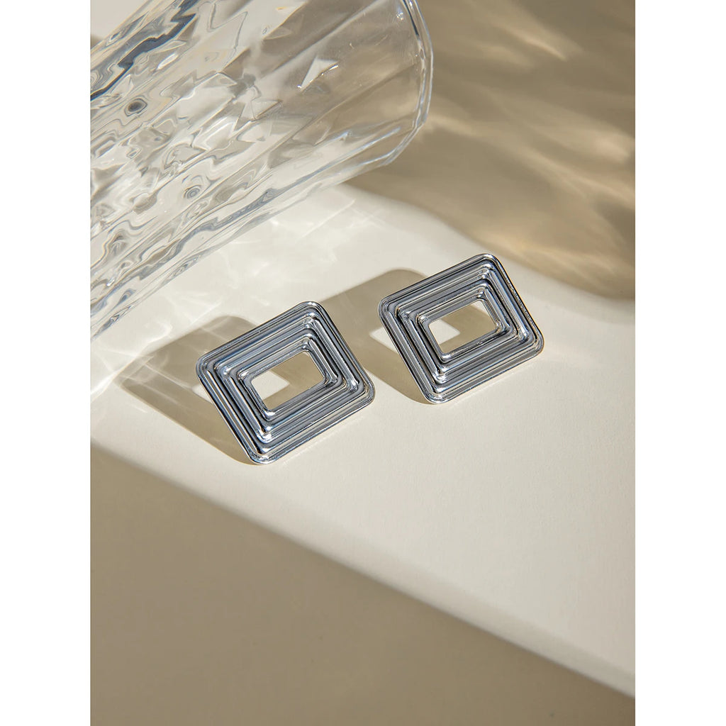 Rektangulært udhulet design Stålfarve Cyclotron Lines Øreringe Metaltekstur Rustfrit stål Stilfulde smykker af høj kvalitet